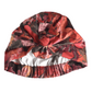 A floral-patterned turban-style cap with a large bow at the top and an elasticized gathered edge, shown on a plain white background.