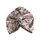 A knotted fabric headwrap or turban-style hair accessory with Liberty Cottage Garden Tana Lawn cotton