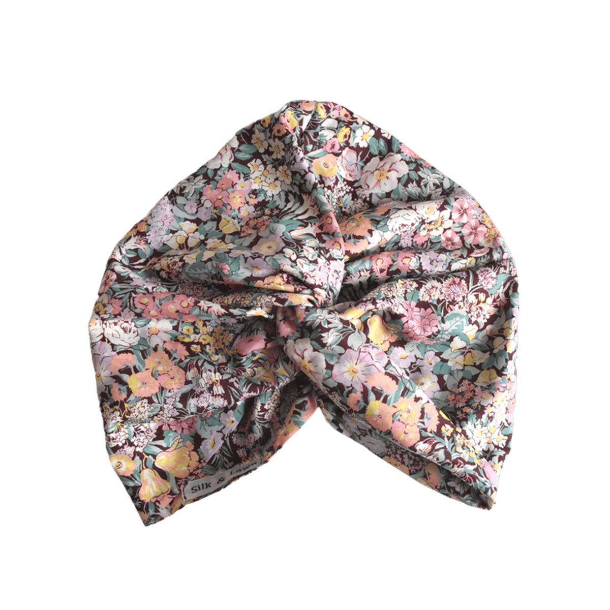 A knotted fabric headwrap or turban-style hair accessory with Liberty Cottage Garden Tana Lawn cotton