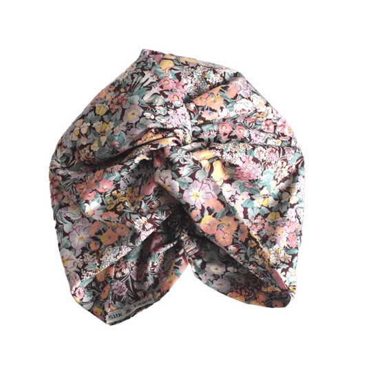 A knotted fabric headwrap or turban-style hair accessory with Liberty Cottage Garden Tana Lawn cotton
