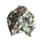 A wool Liberty  fabric headwrap or turban in a muted sage green color, featuring a white floral and red berry pattern, Vintage Liberty Winter Berries in Aqua Blue   - Varuna Wool 